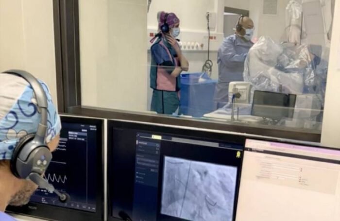 The next-generation Robocath surgical robot in use during a first-in-human trial. Stereotaxis has agreed to acquire the technology.